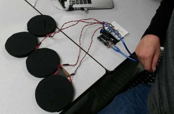 the pads and Arduino controller that comprise a 4-piece electronic drum kit