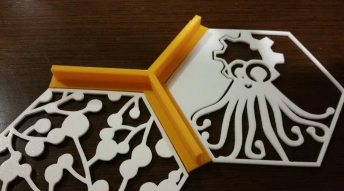 photo of hexagon-shaped cutout images from thingiverse site