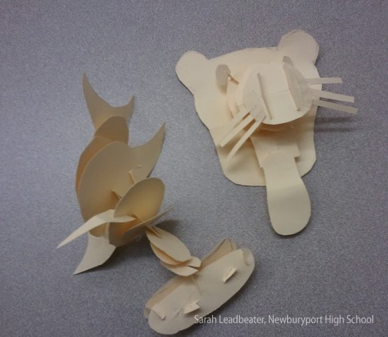 a puma's head, and 2 other animals, made of interlocking cardstock pieces