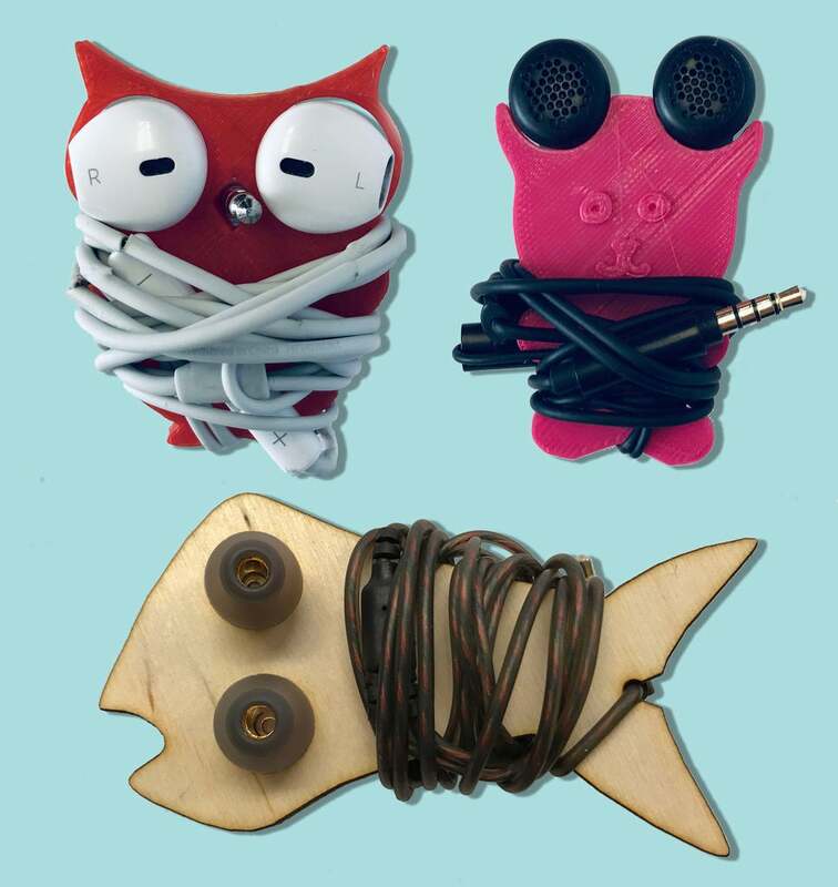 3D printed and laser-cut earbud holders in a variety of animal shapes