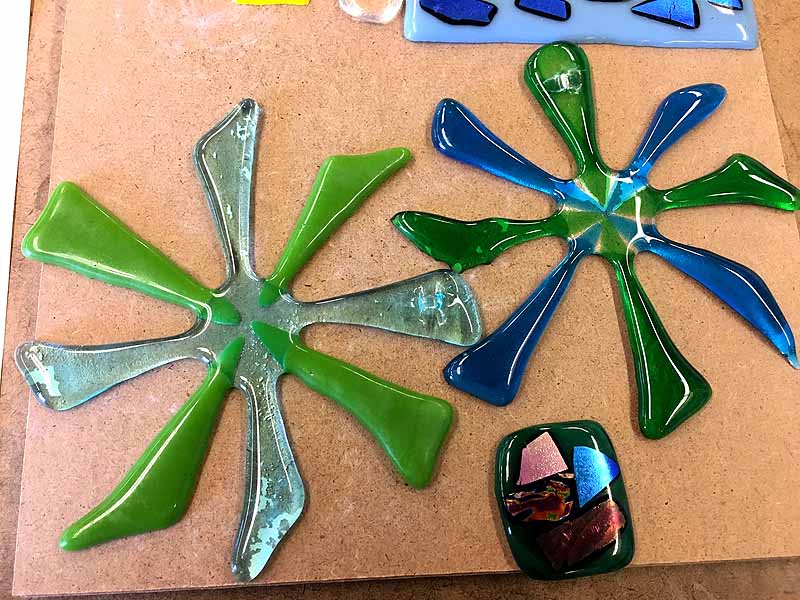 decorate pinwheel sculptures and oblong pendant made of glass