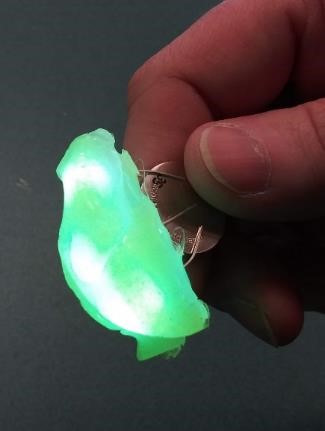a plastic lump made of hot glue, glowing from the inside with embedded LEDs
