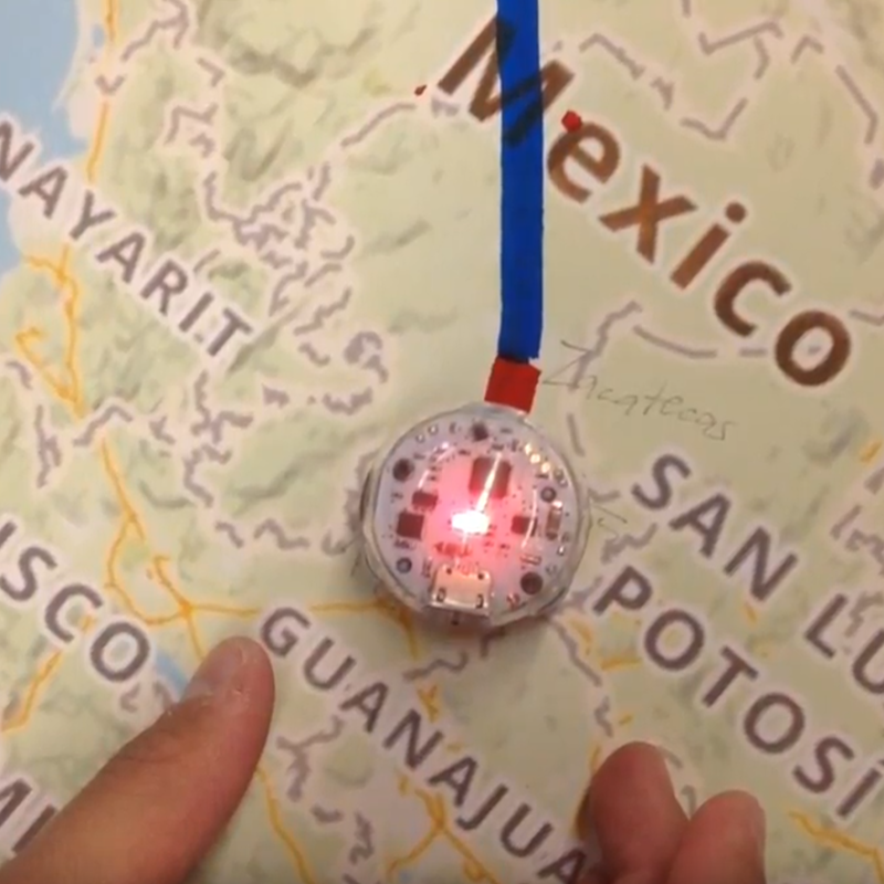 a map of Mexico with a route drawn on, and a small robot glowing at one end of the route line